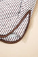 Hem detail of the Stripe Snap Winter Vest with curved edge and brown piping, enhancing its casual and comfortable fit.