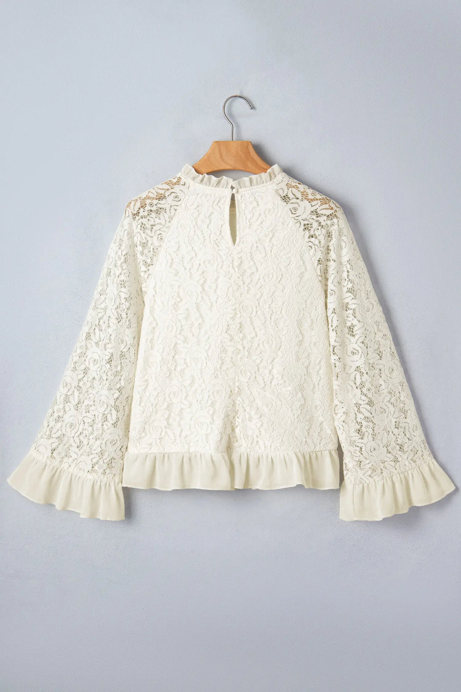 Women's sheer lace blouse model shot casual lifestyle