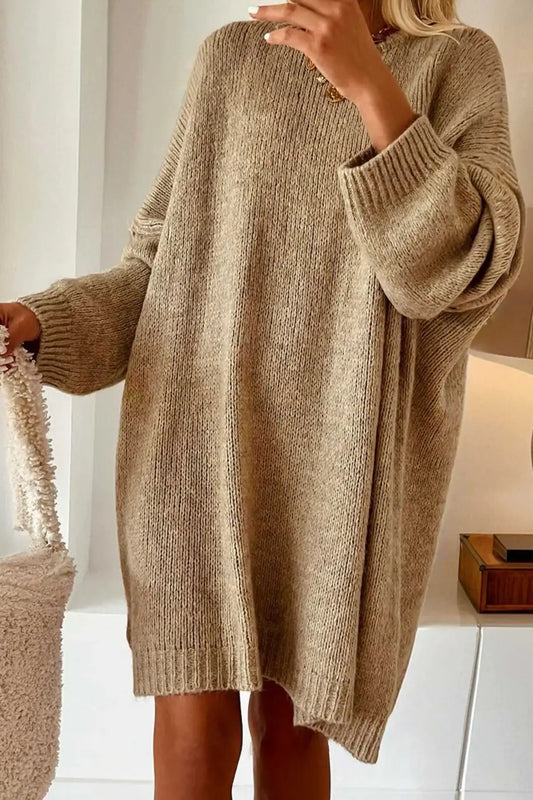 Person wearing a Khaki Oversized Jumper Dress in a minimal indoor setting