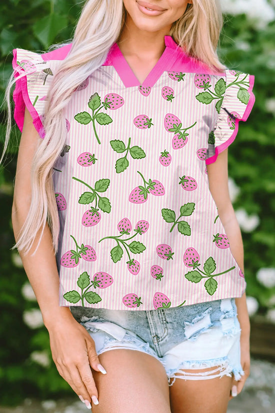Woman wearing pink strawberry print flutter sleeve blouse with V-neck and colour block patchwork front view Fashionfitz UK