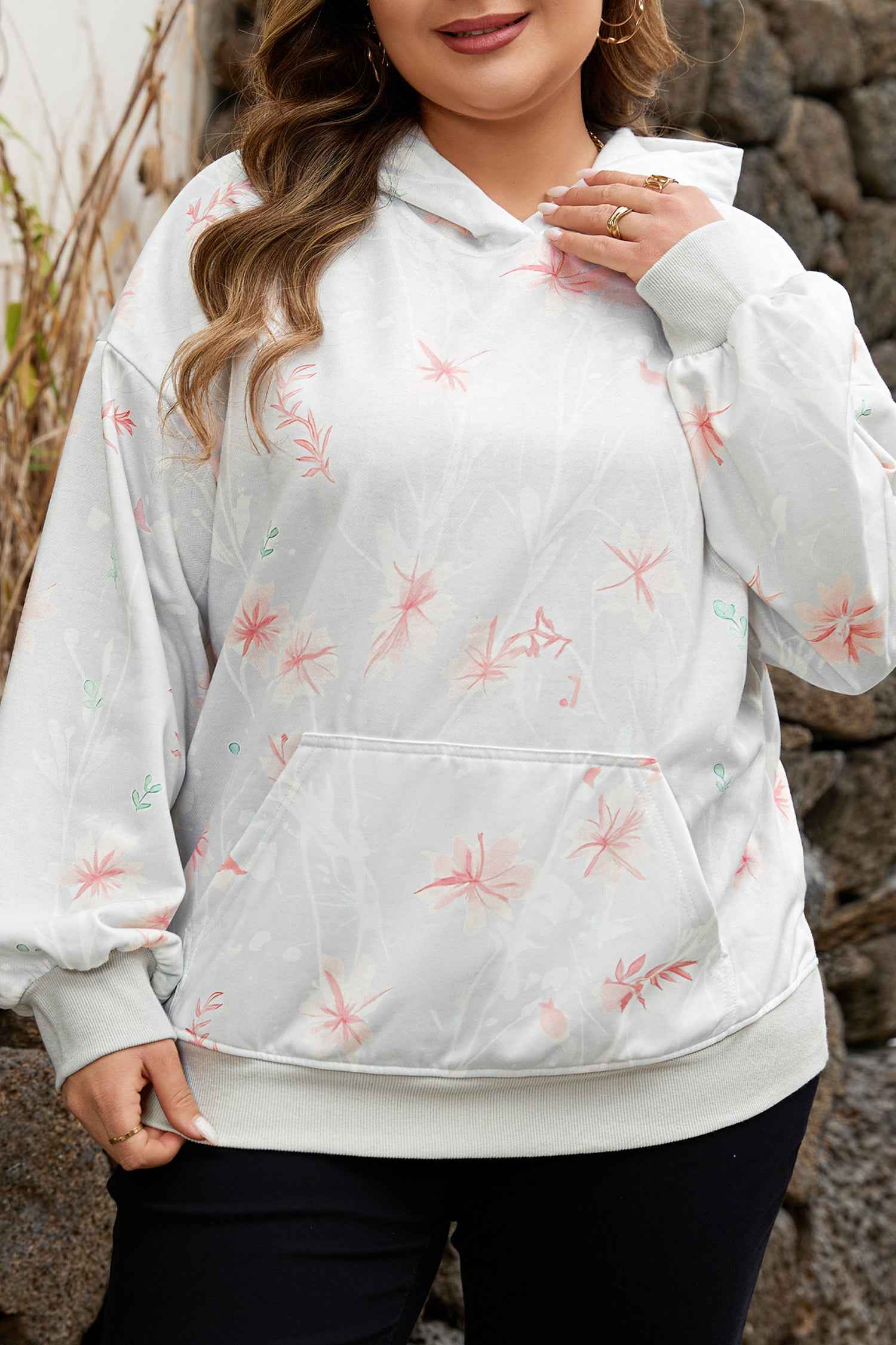 Close-up of Curve Floral Print Hoodie highlighting soft fabric, pink floral pattern, and front pocket for cozy plus size comfort.