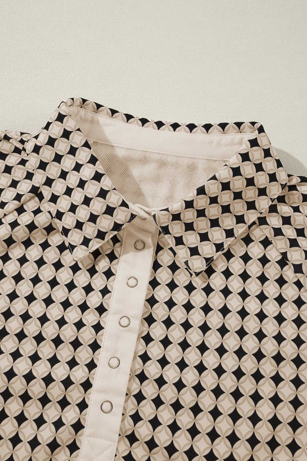 Close-up of collar and buttons on Curve Monochrome Contrast Polo Sweatshirt for Women showcasing detailed craftsmanship.