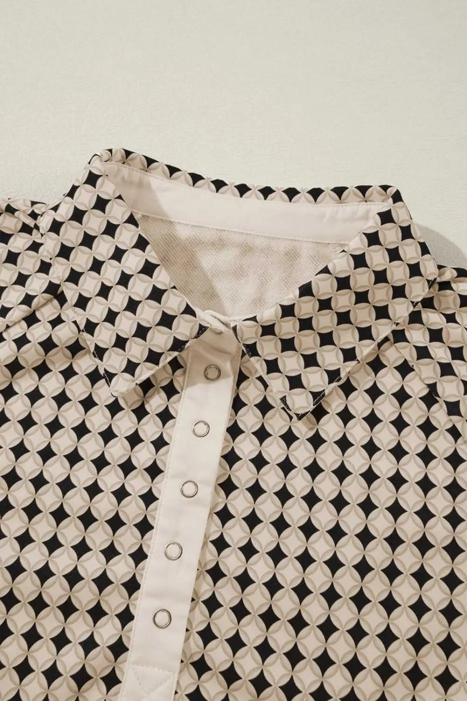 Close-up of collar and buttons on Curve Monochrome Contrast Polo Sweatshirt for Women showcasing detailed craftsmanship.