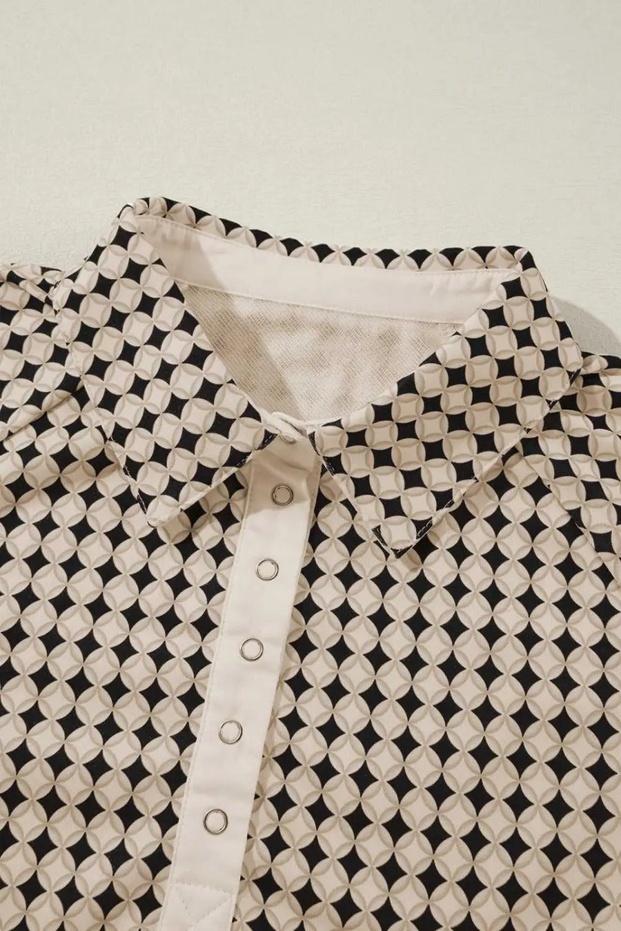 Close-up of collar and buttons on Curve Monochrome Contrast Polo Sweatshirt for Women showcasing detailed craftsmanship.