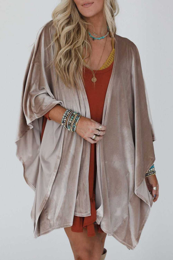 Model wearing smoke grey velvet kimono with open front and relaxed drape