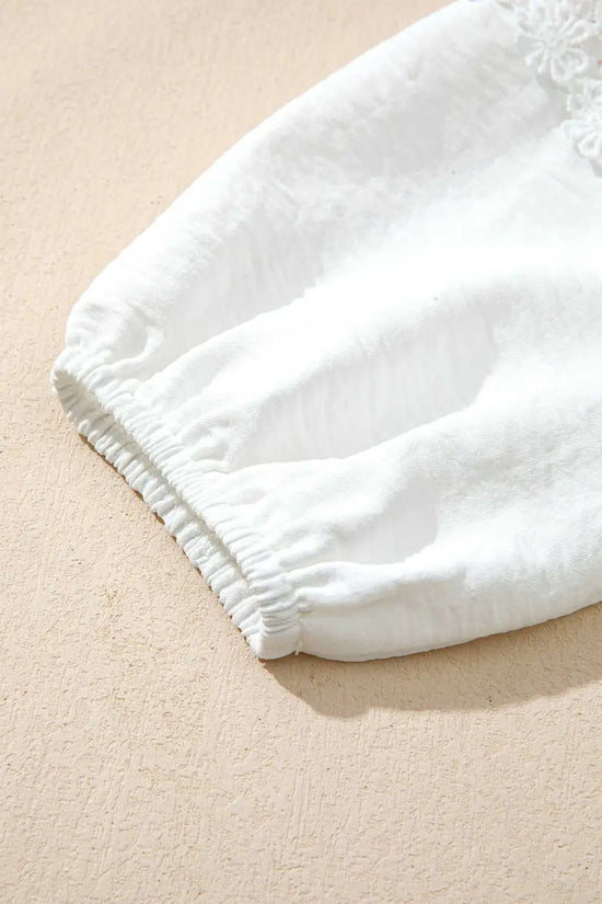 Elastic cuff detail of the White Guipure Lace Frill Blouse sleeve, offering a comfortable fit and subtle volume to the long sleeves.