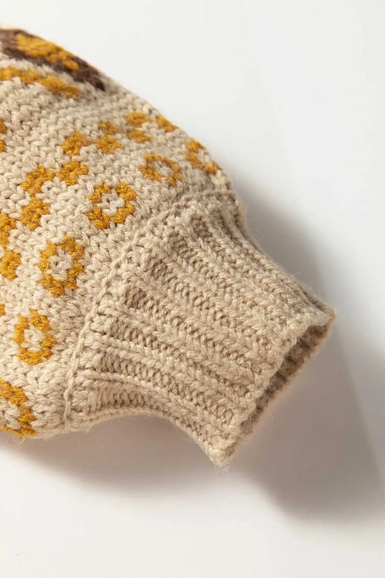 Cuffed sleeve detail of Women's Khaki Western Pattern Knit Cardigan with mustard and brown knit accents. Durable ribbed finish.