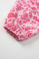 Neckline detail of Pink Floral Lightweight Blouse with gathered back and v-cut front for a feminine silhouette.
