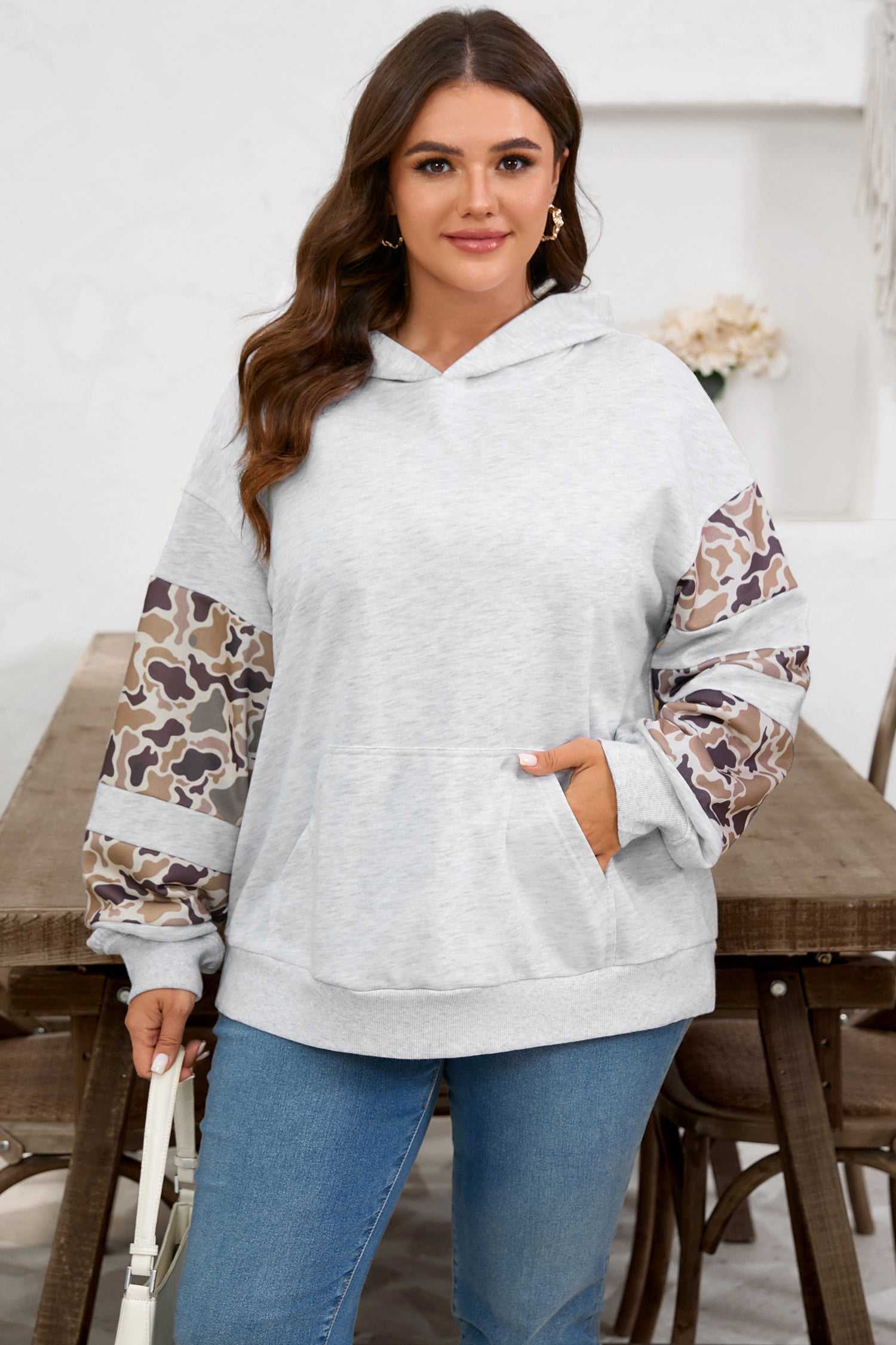 Curve Light Grey Camo Panel Hoodie for Women with camo patchwork sleeves and front pocket, styled for casual plus size fashion.