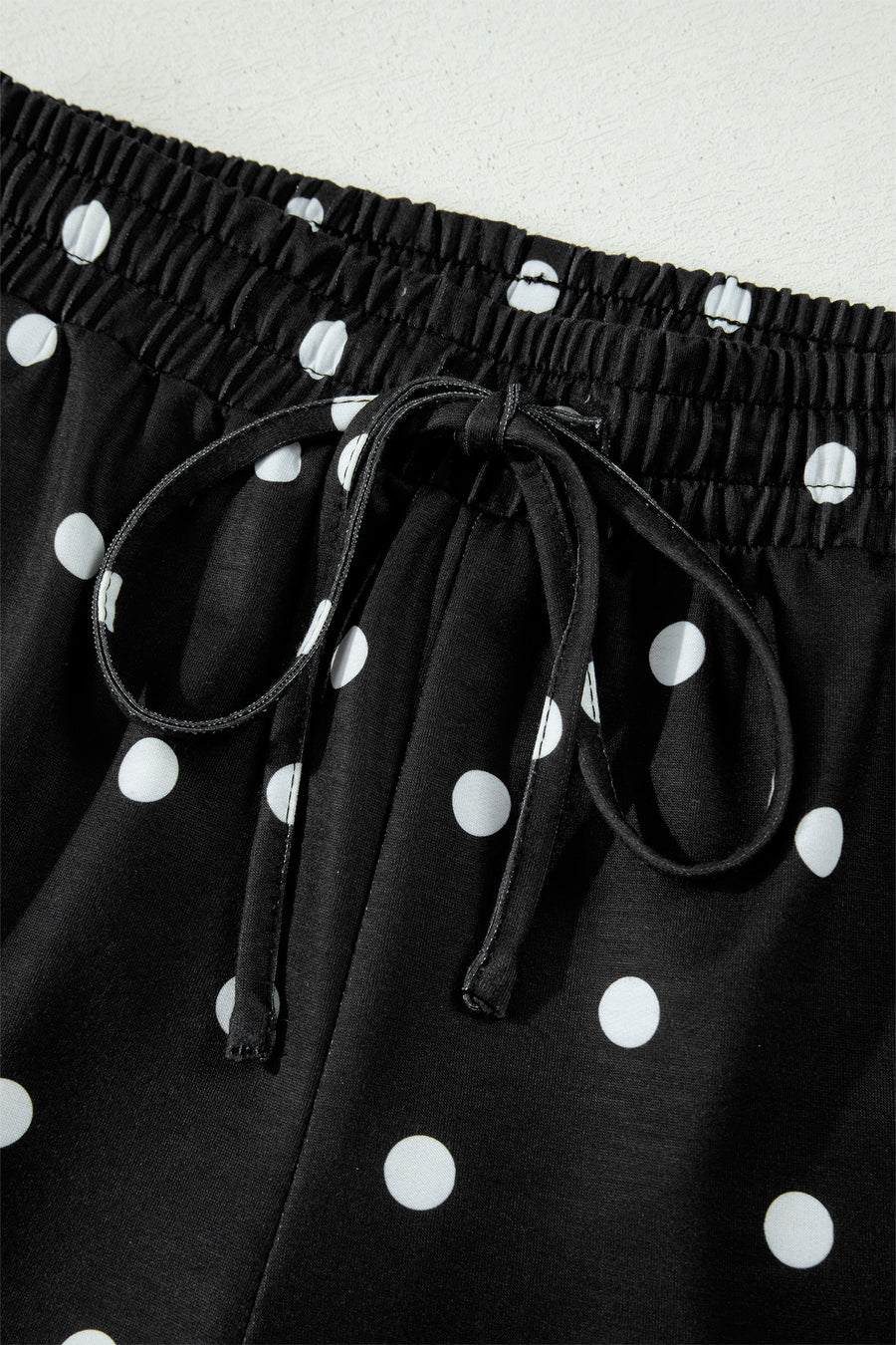 Polka Dot Exposed Seam Loose Tee Drawstring Shorts Two-Piece Set — angled view | Fashionfitz UK