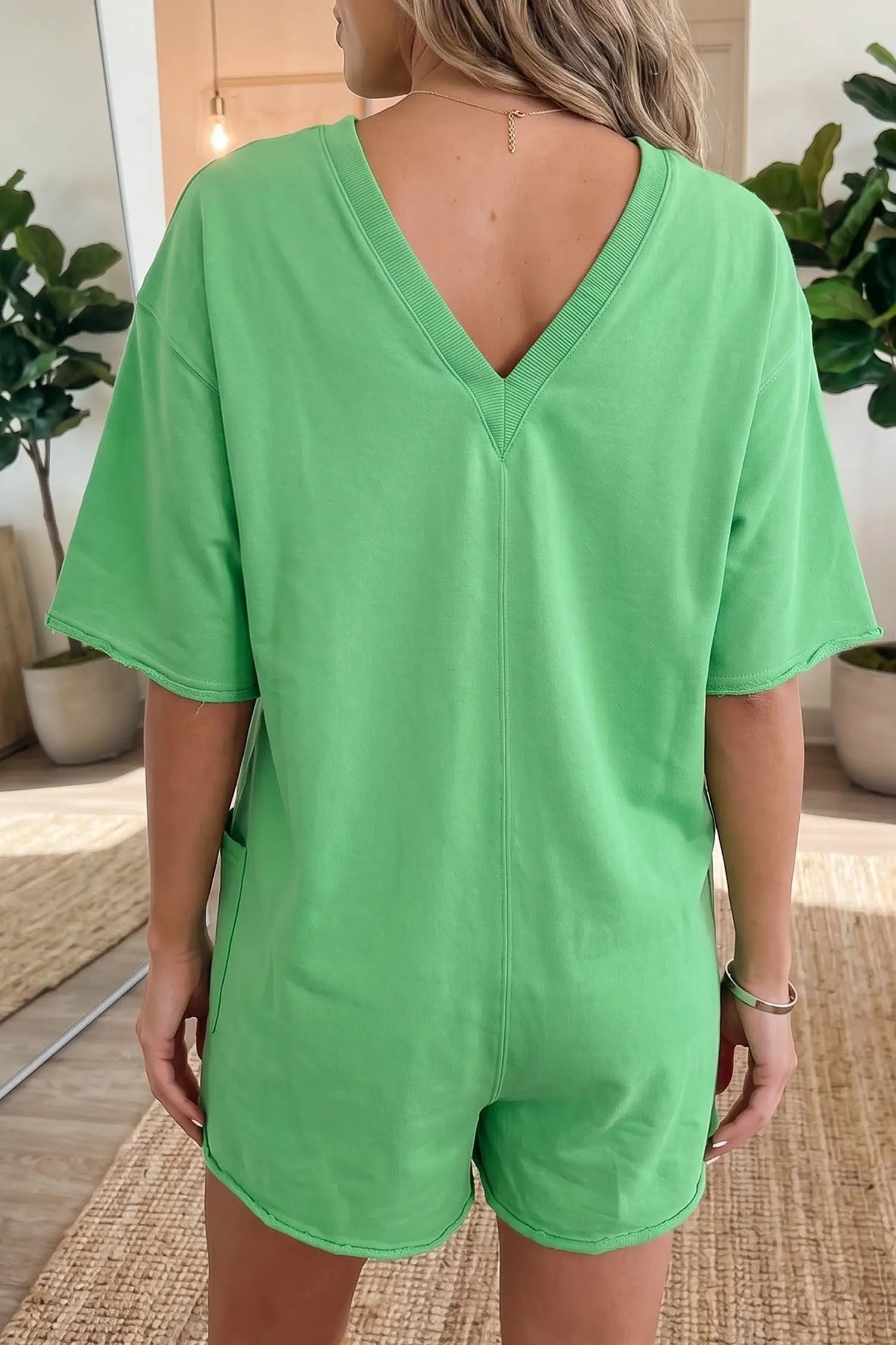 Women's raw edge half sleeve loose romper lifestyle shot casual