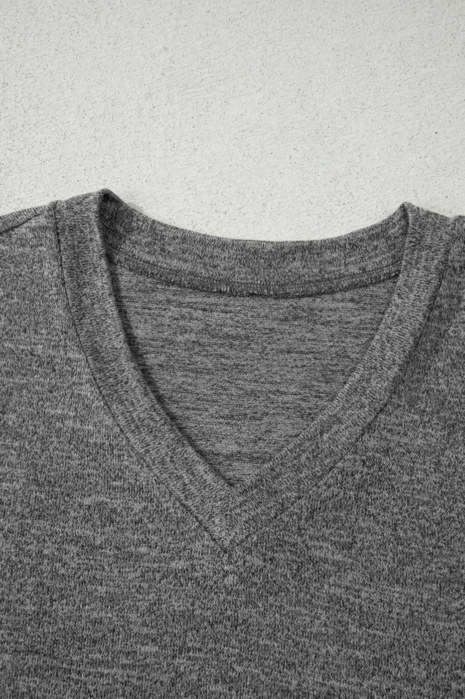 Detail of V-neck top from Heather Mauve Duster Lounge Trio – 3‑Piece Loungewear Set in grey, showcasing neckline stitching and soft fabric.