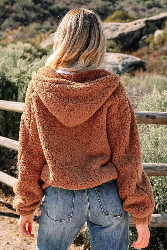 Back view of Women's Zip‑Up Sherpa Hoodie Jacket in soft brown sherpa fabric, showcasing relaxed fit and hood detail.