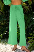 Close-up of green wide-leg pants from the Drop Crop Set, featuring drawstring waist and soft fabric for cozy loungewear appeal.