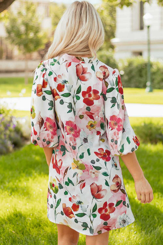 Back view of Floral Shift Dress - Casual Elegance, showcasing colorful floral print and breezy silhouette perfect for summer outings.