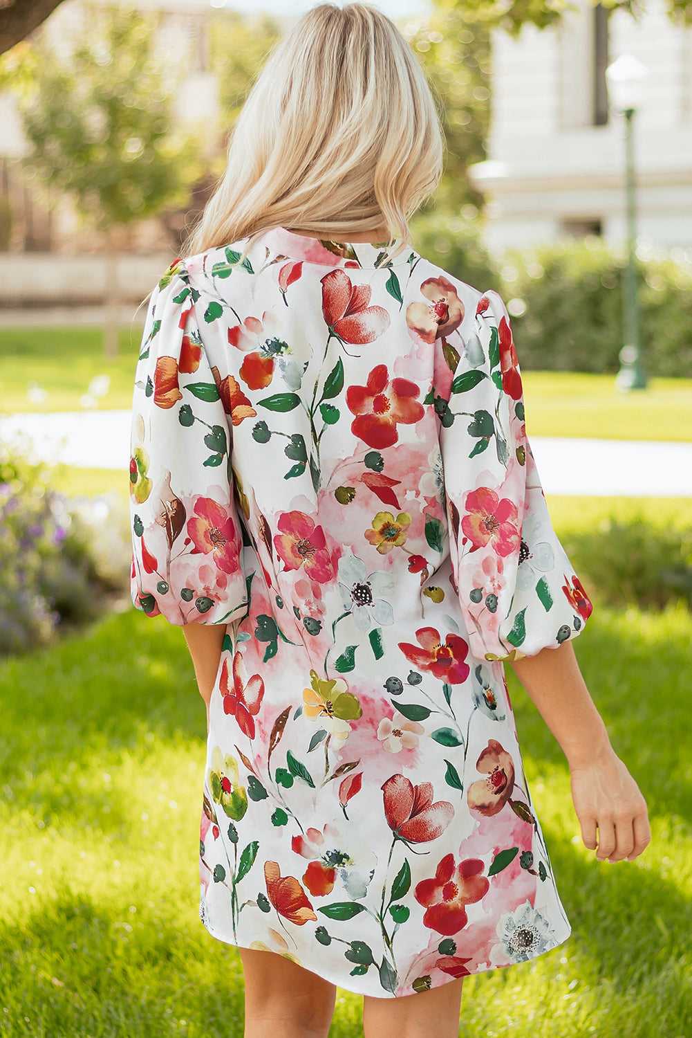 Back view of Floral Shift Dress - Casual Elegance, showcasing colorful floral print and breezy silhouette perfect for summer outings.