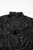 Back neckline detail of black open back sequin party top with soft lining and shimmering finish for evening wear.