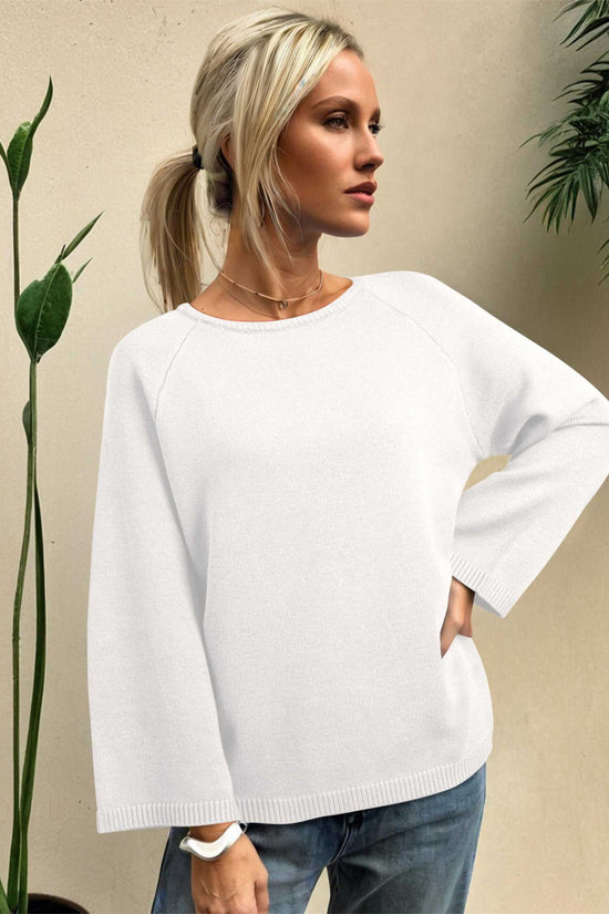 White Bell Sleeve Loose Knit Jumper with statement sleeves and ribbed hem, ideal for cozy autumn styling.