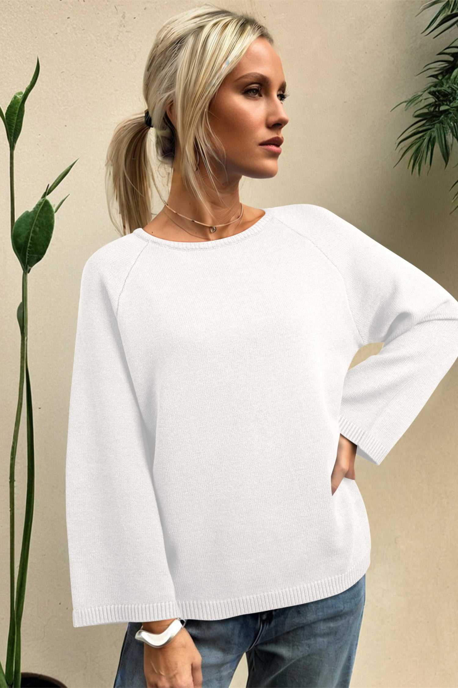 White Bell Sleeve Loose Knit Jumper with statement sleeves and ribbed hem, ideal for cozy autumn styling.