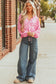 Model standing in Pink Floral Lightweight Blouse and denim, showcasing its airy fit and floral pattern.