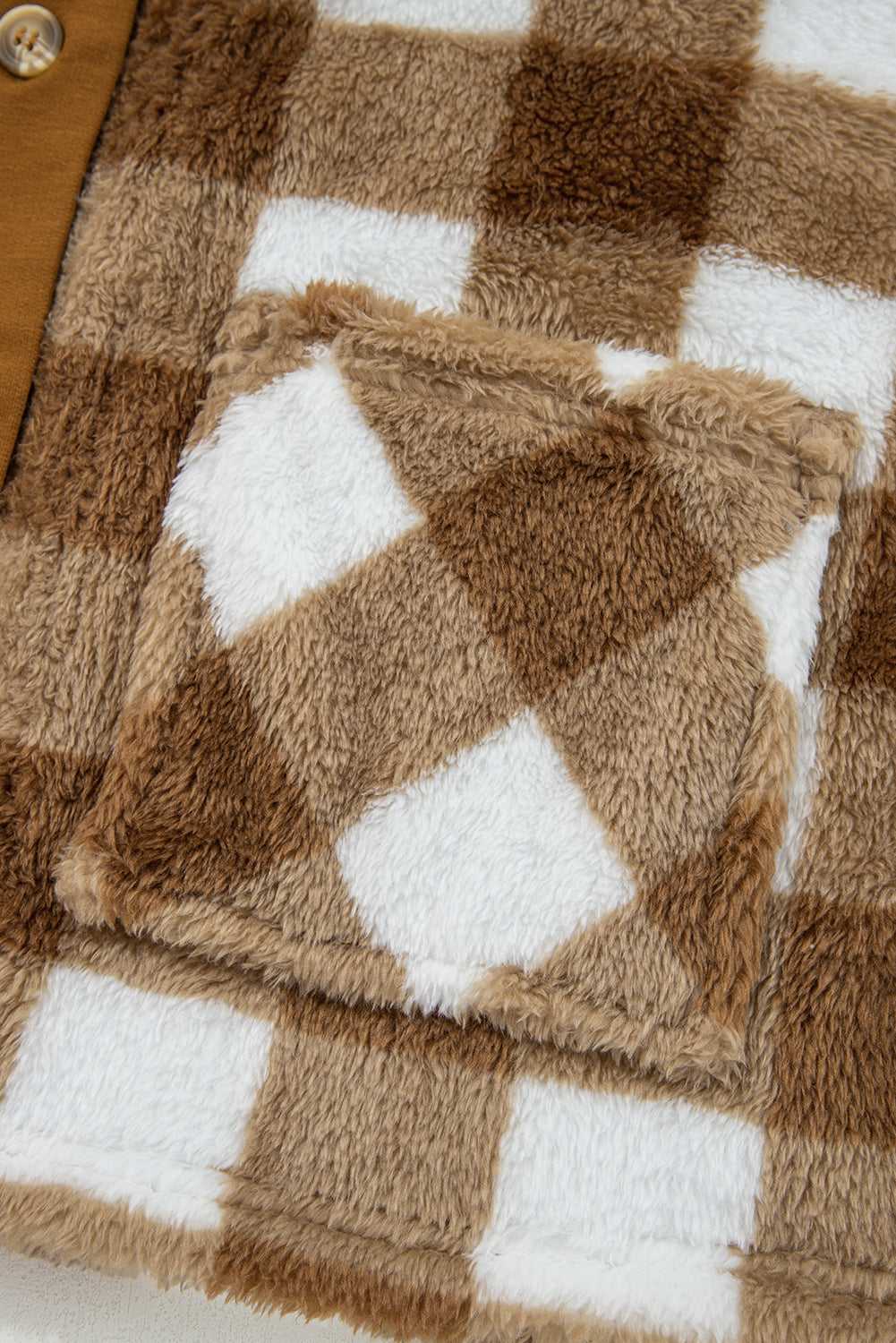 Pocket detail of Women's Brown Checkered Sherpa Cardigan, featuring soft fleece texture and matching plaid pattern for stylish utility.
