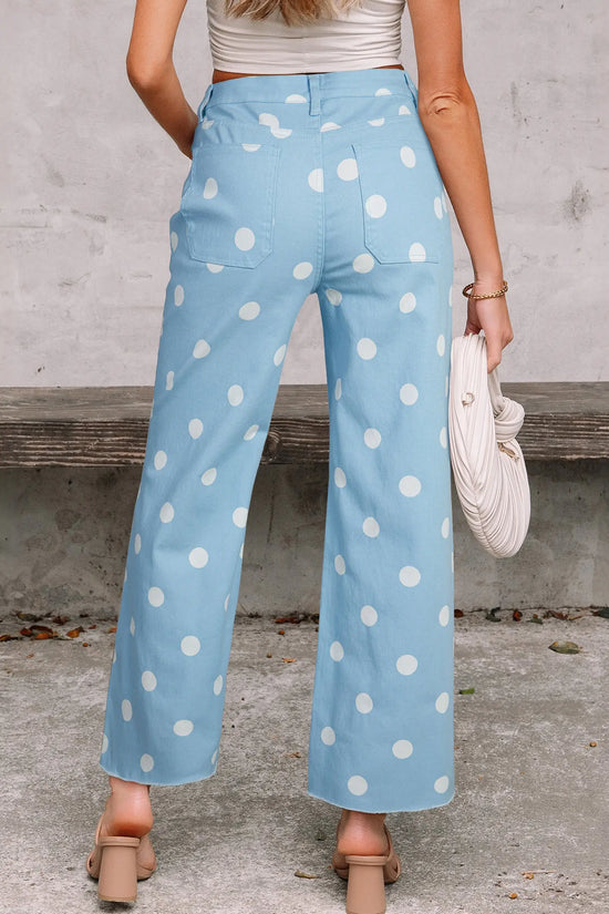 Close-up of sky blue polka dot print denim fabric and raw hem finish on straight leg jeans Fashionfitz UK