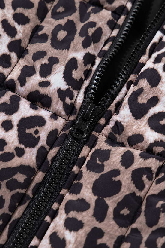Close-up of black zipper on Leopard Print Quilted Puffer Gilet. Durable front fastening enhances this stylish women’s vest.