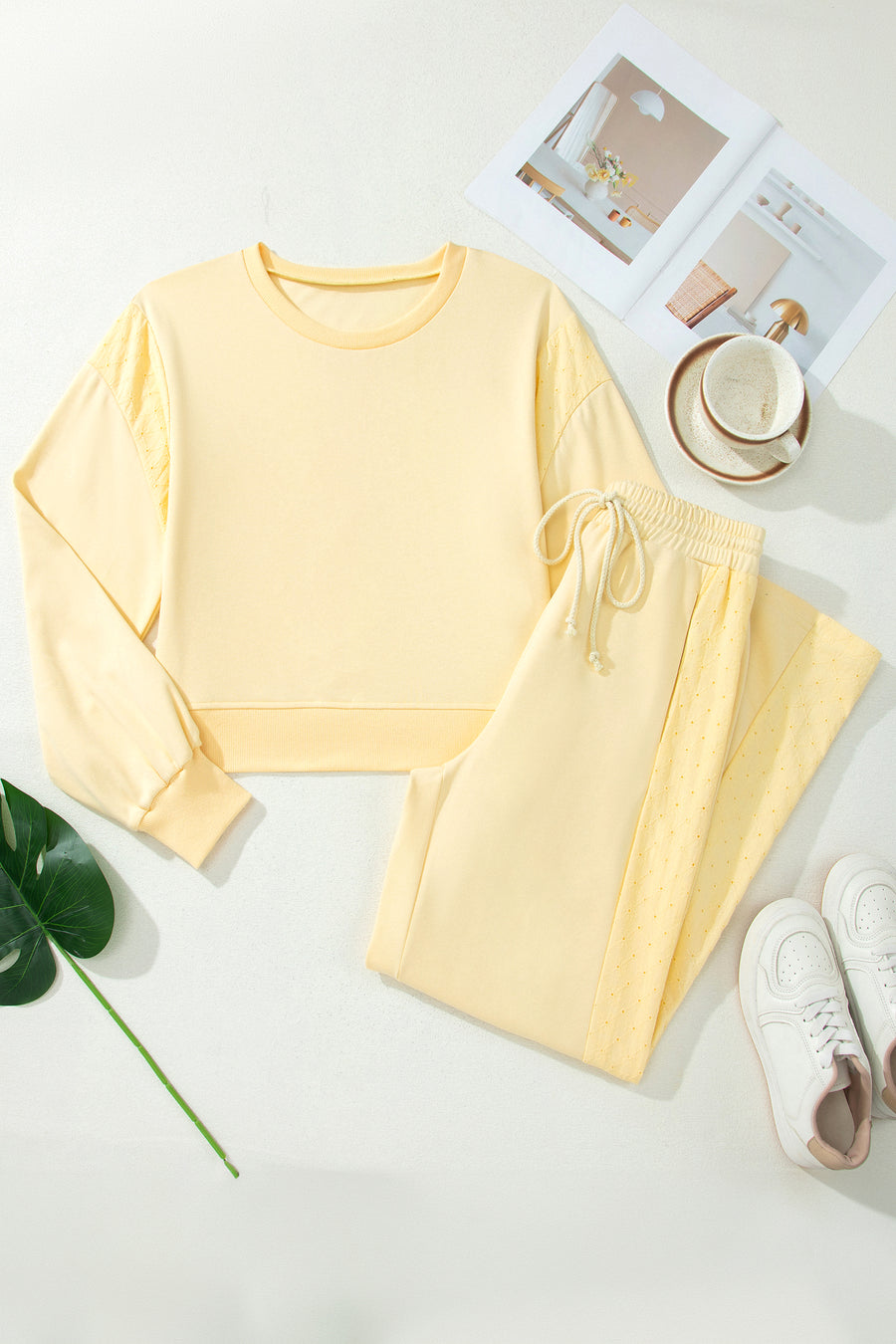 Eyelet embroidery detail close-up on butter yellow cropped pullover — Fashionfitz UK