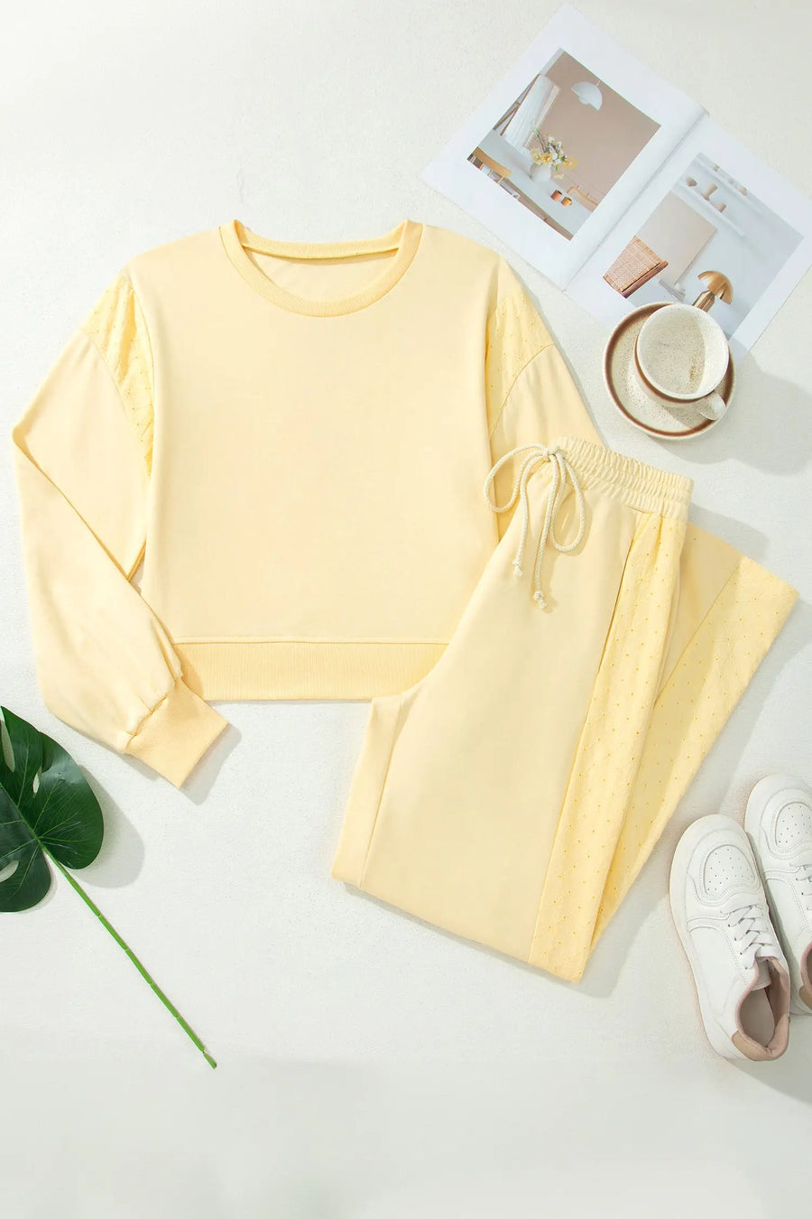 Eyelet embroidery detail close-up on butter yellow cropped pullover — Fashionfitz UK