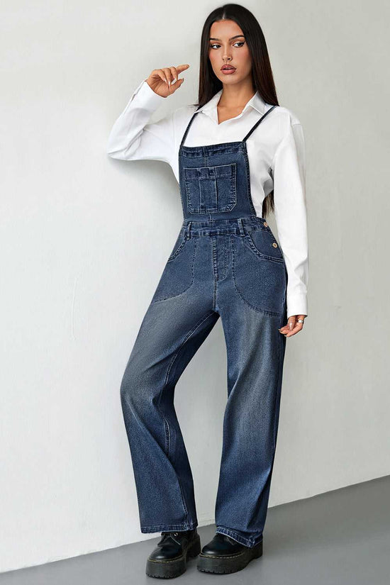 Relaxed-fit dark blue denim overalls for women with front patch pockets and adjustable shoulder straps. Ideal casual jumpsuit for all seasons.