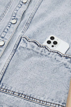 Front pocket of Beau Blue Scallop‑Trim Denim Waistcoat holding a smartphone, demonstrating practical storage in stylish outerwear.