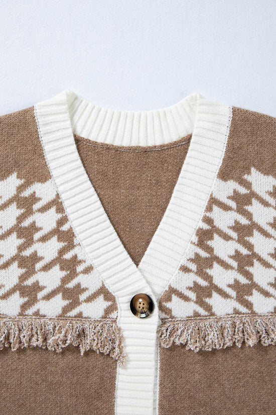 Close-up of khaki houndstooth knit cardigan neckline with white ribbed trim and button detail. Soft knit texture for fall layering.