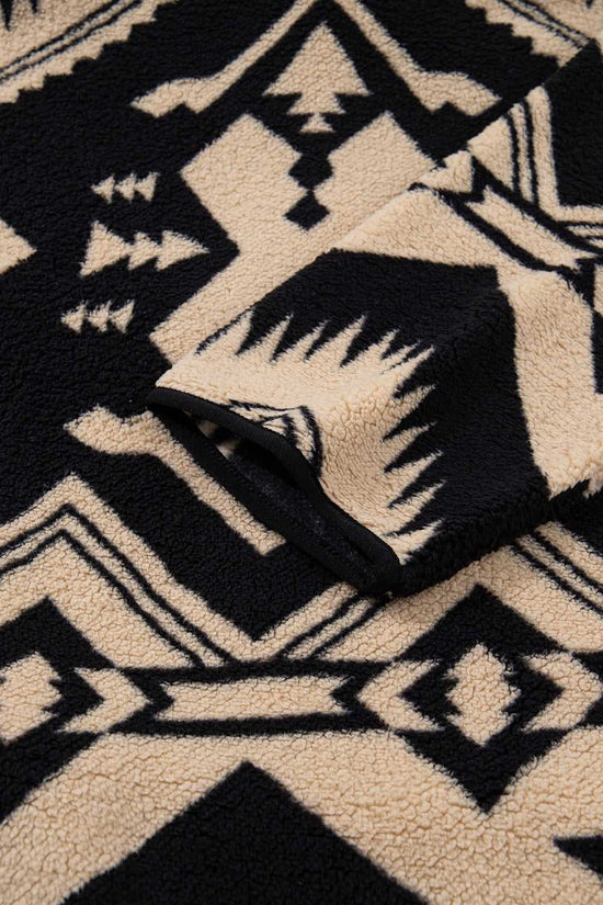 Sleeve detail of Women's Black Plus Size Aztec Print Plush Sweatshirt with Western-style pattern and plush fleece finish for added warmth.