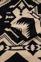 Sleeve detail of Women's Black Plus Size Aztec Print Plush Sweatshirt with Western-style pattern and plush fleece finish for added warmth.