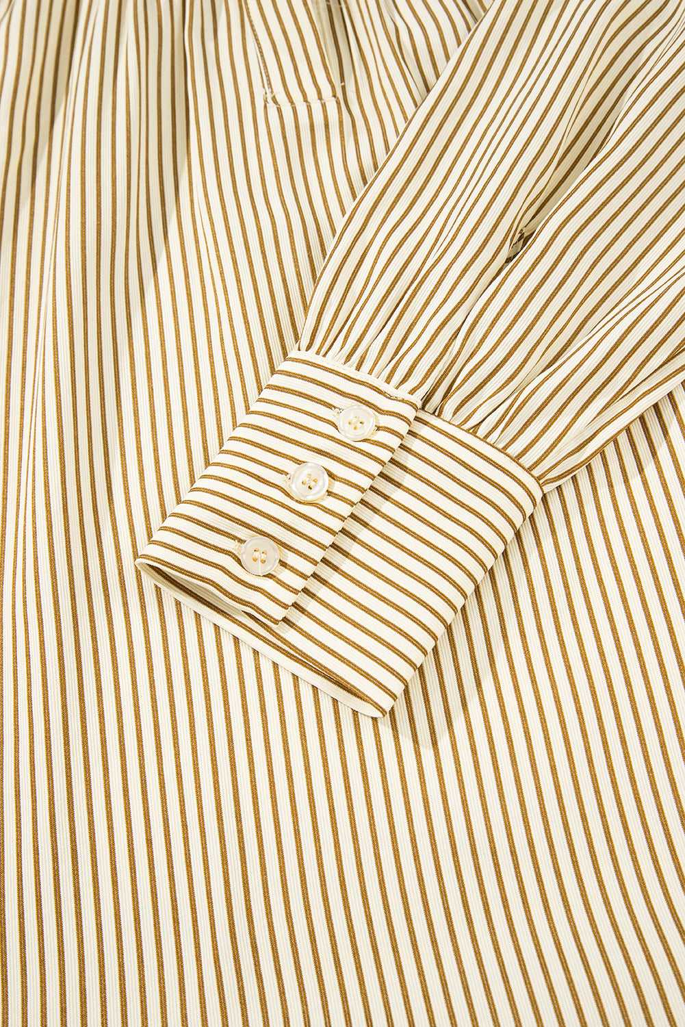 Detail of Brown Stripe Mini Dress sleeve with buttoned cuff. Fine stripe print and tailored finish enhance its casual elegance.