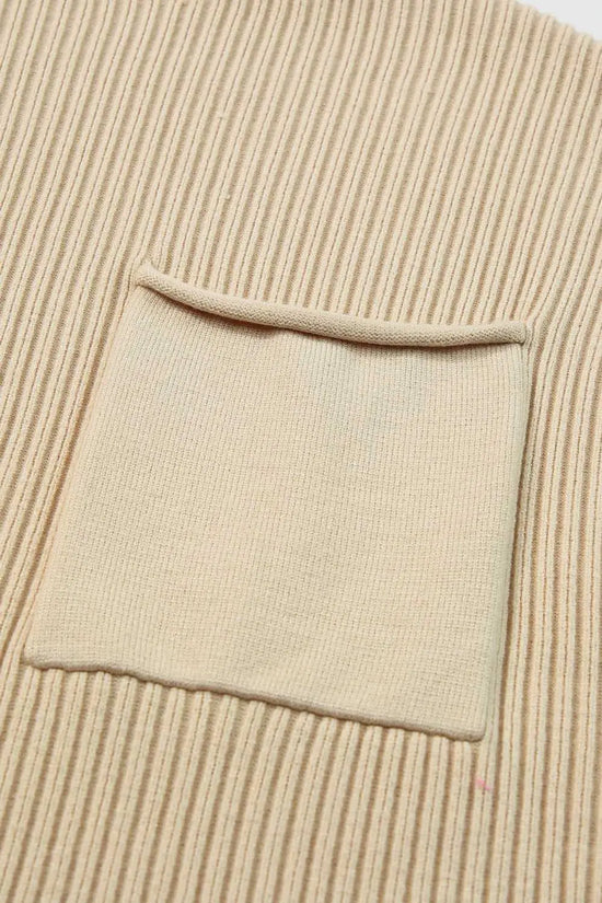Detail of front chest pocket on Ribbed Knit Short Sleeve Sweater, showcasing fine ribbed knit texture and minimalist design.