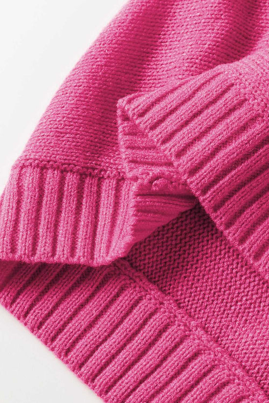 Detailed view of ribbed hem and sleeve cuff on the Stylish High Neck Red Sweater - Christmas, made from 100% acrylic for winter comfort.