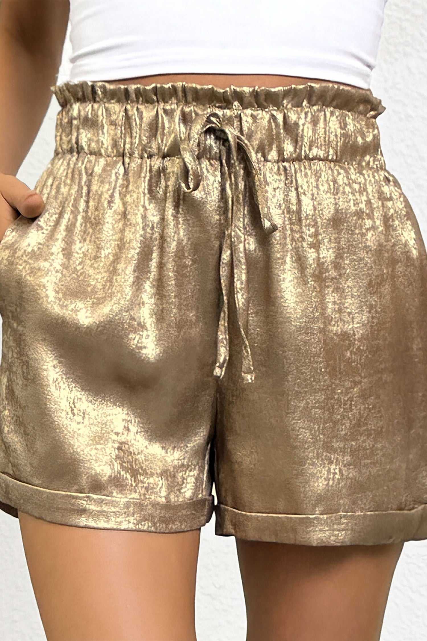 High waist Gold Metallic Shorts Women with drawstring and rolled hem, crafted from metallic fabric for a statement summer style.