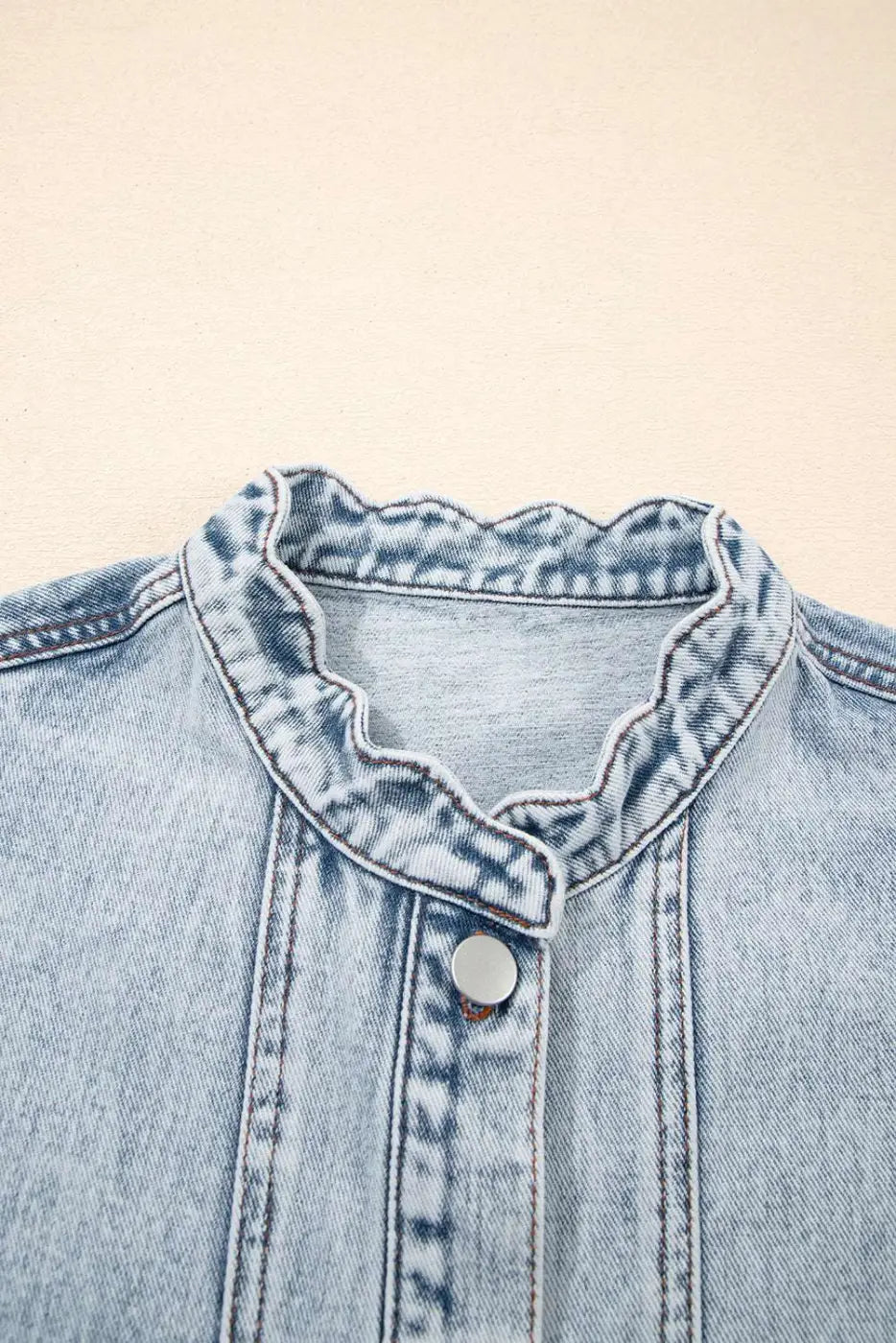 Close-up of scallop-trim neckline on Beau Blue Denim Waistcoat, emphasizing delicate feminine detailing for casual outerwear.