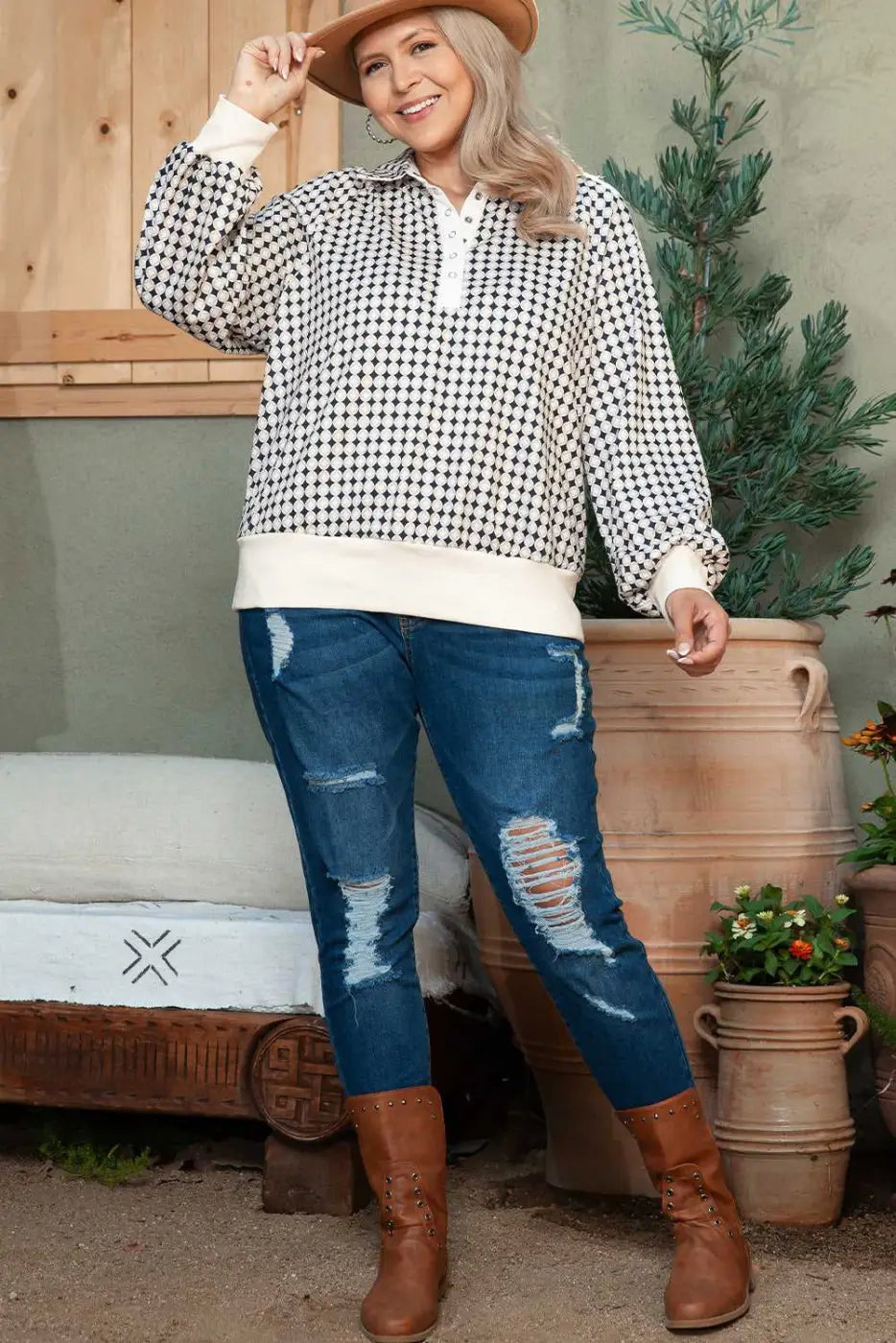 Full outfit view of Curve Monochrome Contrast Polo Sweatshirt for Women paired with ripped jeans and brown boots.
