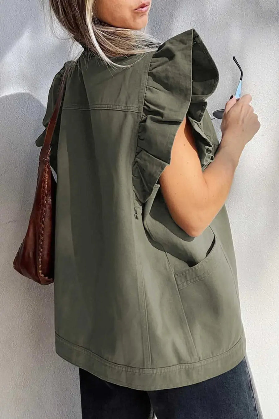 Back view of Green Bay Ruffled Denim Vest - Women's Fashion Trends showing ruffled sleeve detail and relaxed fit for casual outerwear style.