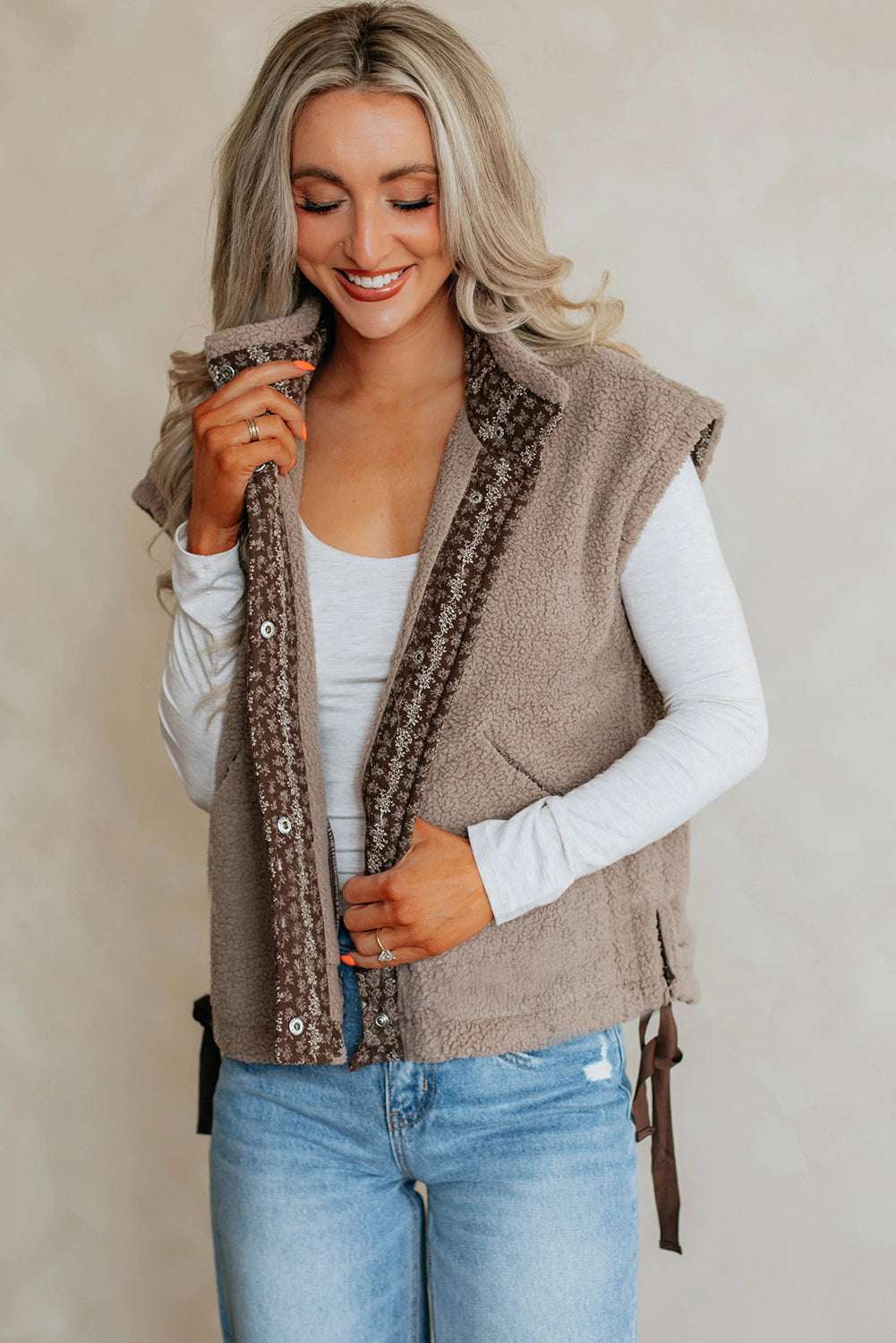 Model smiling in Women's Country Borg Fleece Gilet Winter Vest FashionFitz, highlighting textured fleece and casual autumn style.