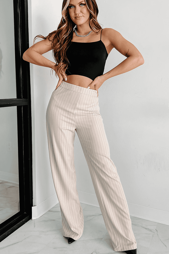 Full outfit featuring black skinny fit crop top and beige pinstripe wide-leg pants, perfect for casual or evening wear.