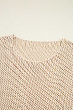 Close-up of a beige knitted sweater on a light beige background