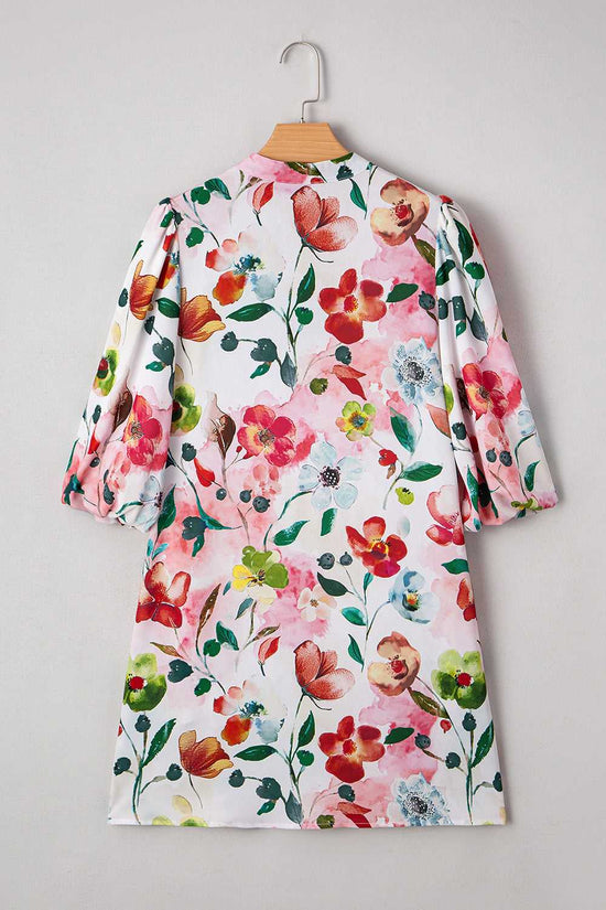 Back view of Floral Shift Dress showcasing vibrant floral pattern and relaxed fit, perfect for casual summer occasions.