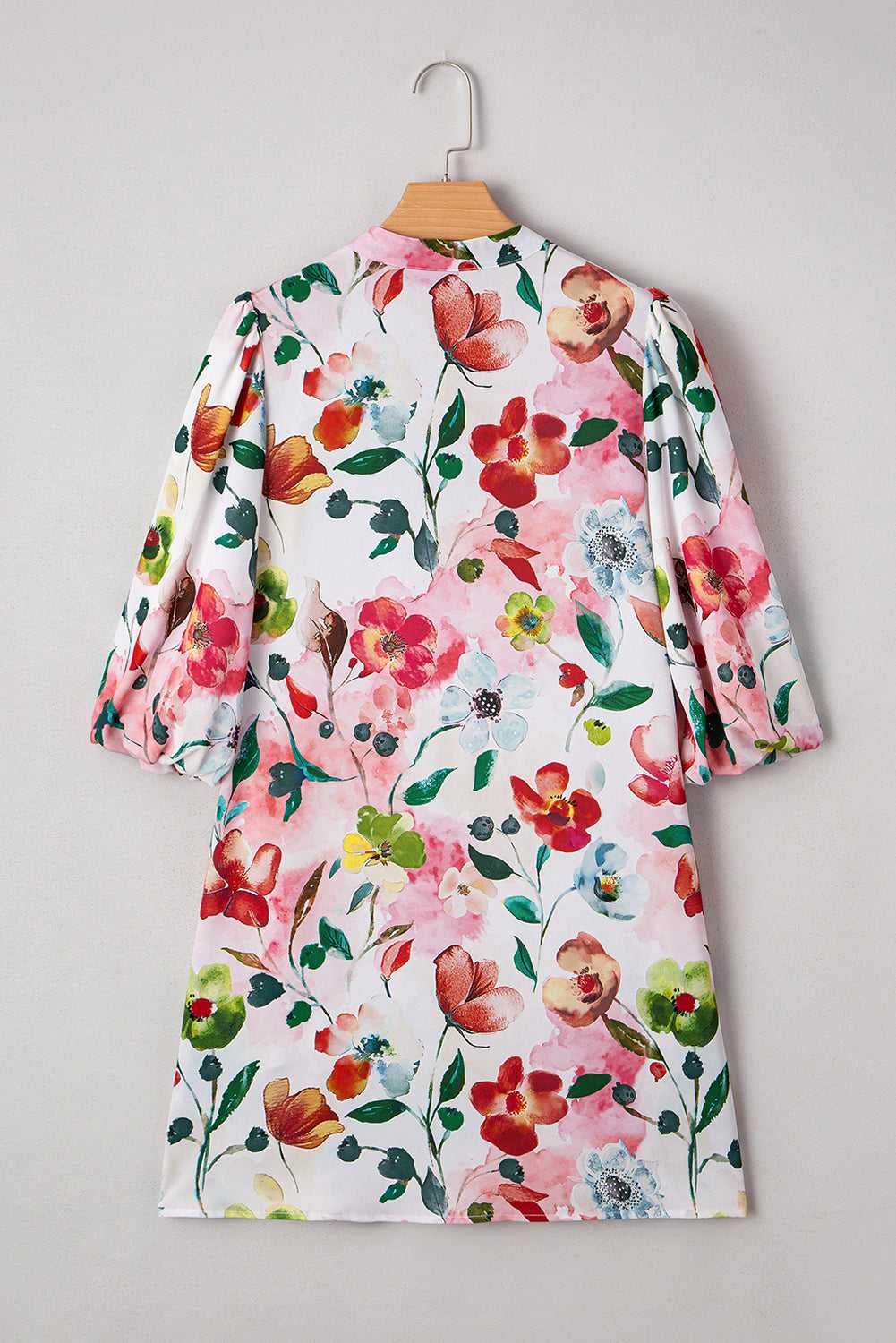 Back view of Floral Shift Dress showcasing vibrant floral pattern and relaxed fit, perfect for casual summer occasions.