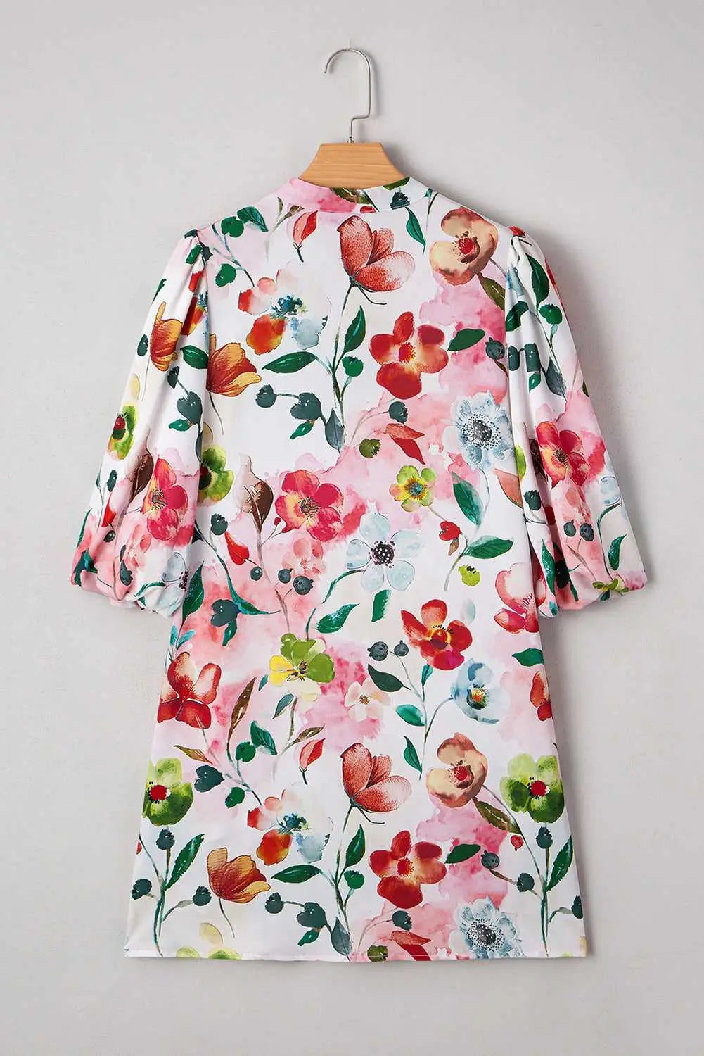 Back view of Floral Shift Dress showcasing vibrant floral pattern and relaxed fit, perfect for casual summer occasions.