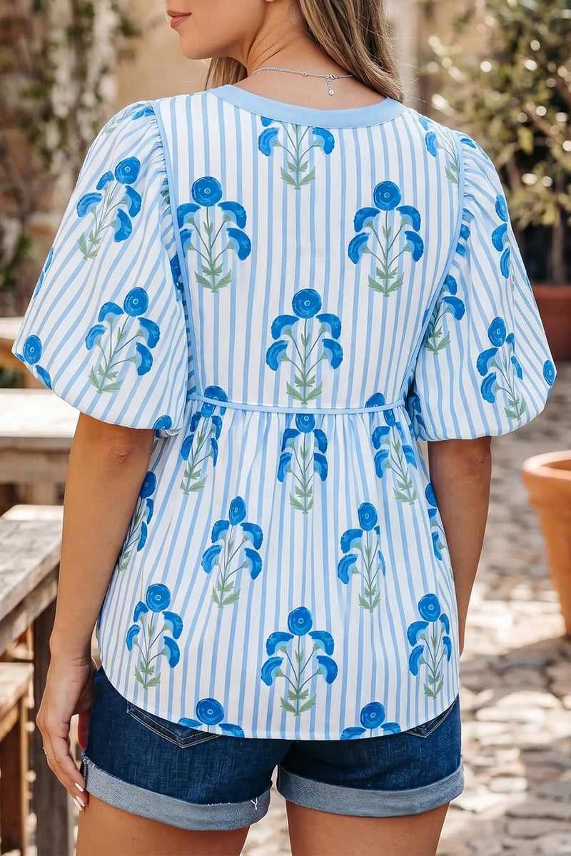 Back view of Floral Print Tie Neck Puff Sleeve Blouse showing puff sleeve construction and relaxed shift silhouette — Fashionfitz