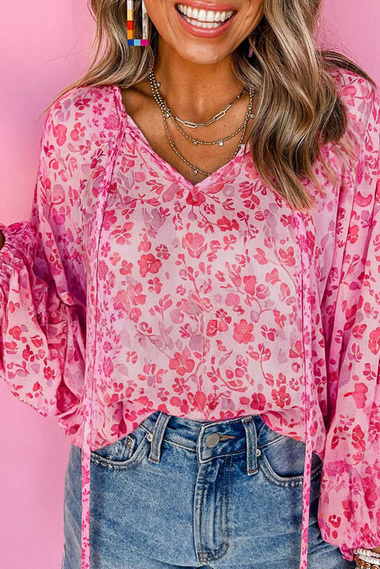 Pink Floral Lightweight Blouse - Chic Elegant Women's Tops styled with denim jeans, featuring a v-neckline and long puff sleeves.