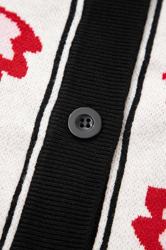 Close-up of floral buttons on beige knit cardigan